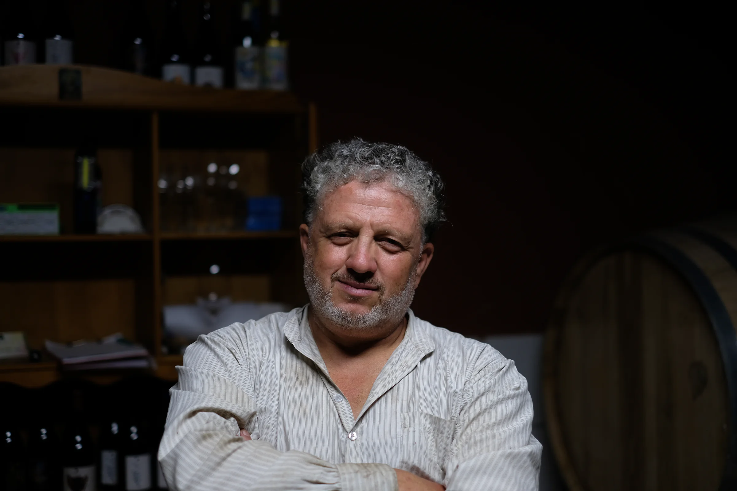 Claudio Miguel Luis Lorenzo seated in the tasting room at his house.